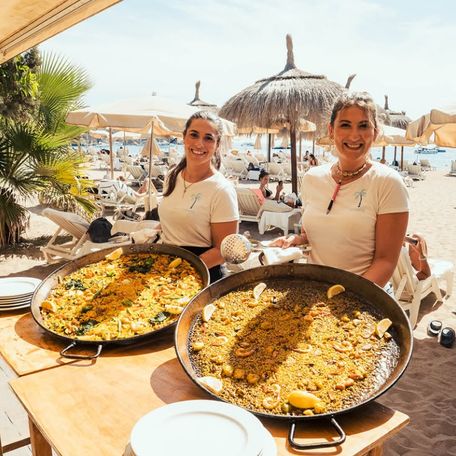 Tropicana Ibiza waitresses with paella